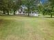 Charming home with a sprawling front yard and mature trees, offering a serene and private setting at 3241 Briscoe Rd, Loganville, GA 30052