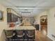 Kitchen with dark wood cabinets, stone countertops, stainless steel appliances, and bar stool seating at 3241 Briscoe Rd, Loganville, GA 30052