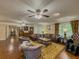 Spacious living room featuring hardwood floors, comfortable seating, and ample natural light at 3241 Briscoe Rd, Loganville, GA 30052