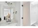 Well-lit bathroom featuring double towel holders, a framed mirror, and a combined tub and shower at 790 Thornberry Dr, Alpharetta, GA 30022