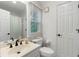 This full bathroom has tile floors, modern fixtures, and a combined tub and shower at 790 Thornberry Dr, Alpharetta, GA 30022