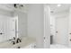 This bright bathroom features a framed mirror, vanity, and separate area for the toilet and shower at 790 Thornberry Dr, Alpharetta, GA 30022