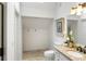 Bright bathroom with granite countertop vanity, modern fixtures, toilet, and storage space at 790 Thornberry Dr, Alpharetta, GA 30022
