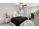 This comfy bedroom has great natural light, a ceiling fan, and ample space for both sleeping and working at home at 790 Thornberry Dr, Alpharetta, GA 30022