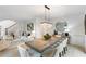 Dining room area showing open floorplan, modern chandelier and view to living room at 790 Thornberry Dr, Alpharetta, GA 30022