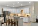 Bright kitchen with white cabinets, granite countertops, a center island, and stainless steel appliances at 790 Thornberry Dr, Alpharetta, GA 30022