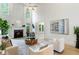 Spacious living room with a fireplace, high ceilings, lots of natural light, and hardwood floors at 790 Thornberry Dr, Alpharetta, GA 30022