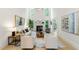 Airy living room boasts soaring ceilings, a fireplace, large windows, and stylish decor at 790 Thornberry Dr, Alpharetta, GA 30022