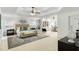 Spacious main bedroom suite with sitting area, tray ceiling, and decorative furnishings at 790 Thornberry Dr, Alpharetta, GA 30022