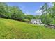 Estate backyard with mature trees plus a pool and outdoor recreation area for the whole Gathering at 143 Navajo Trl, Rydal, GA 30171