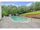 Backyard with an inground pool, jacuzzi, and mature tree line at 143 Navajo Trl, Rydal, GA 30171