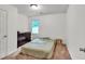 Clean bedroom with a bed, dresser, and window, offering a calming space at 143 Navajo Trl, Rydal, GA 30171