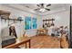 Bright bedroom featuring a ceiling fan and a desk setup at 143 Navajo Trl, Rydal, GA 30171