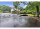 Inviting exterior with a porch, set on a spacious lot with lush landscaping and a long driveway at 143 Navajo Trl, Rydal, GA 30171