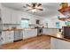 Bright kitchen featuring white cabinets, stainless steel appliances, wood counters and floors at 143 Navajo Trl, Rydal, GA 30171