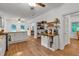 Bright kitchen featuring white cabinets, stainless steel appliances, wood counters and floors at 143 Navajo Trl, Rydal, GA 30171