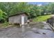 A functional outbuilding on a large lot provides ample storage for vehicles, equipment, and recreational toys at 143 Navajo Trl, Rydal, GA 30171