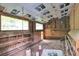 Interior view of a chicken coop with nesting boxes, natural light, and simple construction at 143 Navajo Trl, Rydal, GA 30171