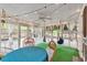 Cozy porch with string lights, hammocks, and a dining table for outdoor entertaining at 143 Navajo Trl, Rydal, GA 30171