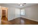 A bedroom featuring hardwood floors, a window, closet and neutral walls at 1992 Cascade Sw Rd, Atlanta, GA 30311