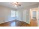 Bedroom featuring hardwood floors, ceiling fan, closet, and access to bathroom at 1992 Cascade Sw Rd, Atlanta, GA 30311