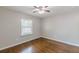 Bedroom features hardwood flooring and a window providing natural light at 1992 Cascade Sw Rd, Atlanta, GA 30311