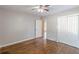 Bedroom featuring hardwood floors, closet space, a window, and neutral walls at 1992 Cascade Sw Rd, Atlanta, GA 30311