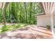 Wide wooden deck overlooking a backyard with a fire pit and dense, mature trees at 1992 Cascade Sw Rd, Atlanta, GA 30311
