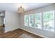Bright dining area featuring large windows with wooded views and modern lighting at 1992 Cascade Sw Rd, Atlanta, GA 30311