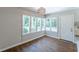 Bright dining area with hardwood floors, large windows, and modern chandelier at 1992 Cascade Sw Rd, Atlanta, GA 30311