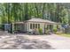 Charming, one-story home with a well-manicured lawn, carport, and extra storage at 1992 Cascade Sw Rd, Atlanta, GA 30311