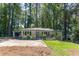 Charming, one-story home with a well-manicured lawn, carport, and inviting front porch at 1992 Cascade Sw Rd, Atlanta, GA 30311