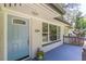 Charming front porch features a blue door and space for a warm welcome at 1992 Cascade Sw Rd, Atlanta, GA 30311