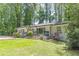 Well-maintained front yard of a charming one-story home with a fresh, green lawn at 1992 Cascade Sw Rd, Atlanta, GA 30311