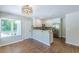 Kitchen featuring white cabinets, stainless steel appliances, and a breakfast bar at 1992 Cascade Sw Rd, Atlanta, GA 30311