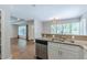 Open concept living area showcasing kitchen with stainless steel appliances at 1992 Cascade Sw Rd, Atlanta, GA 30311