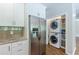 Kitchen featuring stainless steel appliances, granite countertops, and stacked washer/dryer at 1992 Cascade Sw Rd, Atlanta, GA 30311