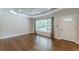 Bright living room showcasing hardwood floors, modern paint colors, and a tray ceiling with a ceiling fan at 1992 Cascade Sw Rd, Atlanta, GA 30311