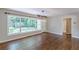 Bright living room features hardwood floors and modern lighting fixture at 1992 Cascade Sw Rd, Atlanta, GA 30311