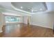 Spacious living room features hardwood floors, recessed lighting, and a large window with backyard views at 1992 Cascade Sw Rd, Atlanta, GA 30311