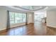 Inviting living room with hardwood floors, large windows, and open access to the kitchen at 1992 Cascade Sw Rd, Atlanta, GA 30311