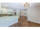 Open-concept living space with a bar area, stainless steel appliances, and hardwood floors at 1992 Cascade Sw Rd, Atlanta, GA 30311