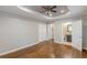 The spacious main bedroom includes hardwood floors, a ceiling fan, and a private bathroom at 1992 Cascade Sw Rd, Atlanta, GA 30311