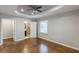 Hardwood floors, a ceiling fan, an ensuite bathroom, and lots of space define the main bedroom at 1992 Cascade Sw Rd, Atlanta, GA 30311