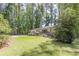 Spacious, well-maintained lawn on the side of a charming one-story home at 1992 Cascade Sw Rd, Atlanta, GA 30311