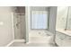 Bathroom with a soaking tub, glass enclosed shower and modern fixtures at 2203 Beacon Crest Dr, Buford, GA 30519