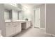 Bathroom with white vanity, double sinks, and neutral walls creating a clean, inviting space at 2203 Beacon Crest Dr, Buford, GA 30519