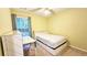 Cozy bedroom with window, bed, and desk at 2203 Beacon Crest Dr, Buford, GA 30519