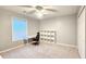 Neutral bedroom with ceiling fan, window, closet, desk and chair at 2203 Beacon Crest Dr, Buford, GA 30519