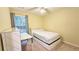 Bright bedroom featuring a bed, desk, and a window providing natural light at 2203 Beacon Crest Dr, Buford, GA 30519